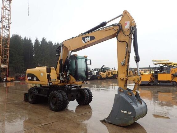 Аренда колесного экскаватора Caterpillar M320D2 с грейфером